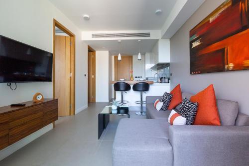 Oceanstone by Holy Cow, 1-BR, next building view - Tap to explore photos