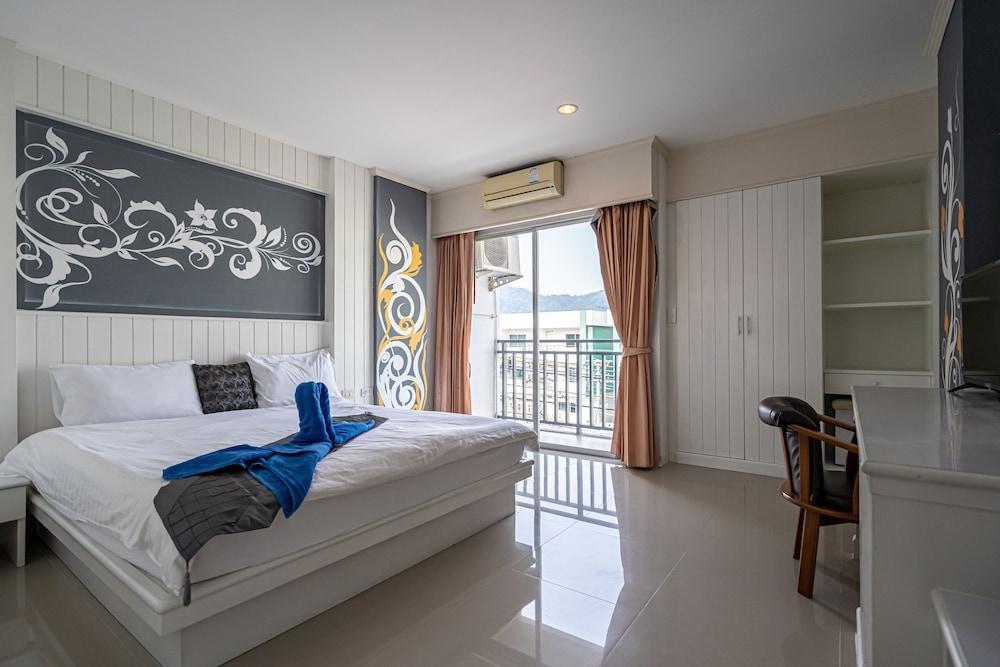 Santi White House Patong Hotel - Tap to explore photos