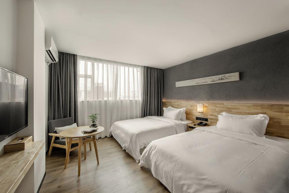 Shuge Art Hotel - Tap to explore photos