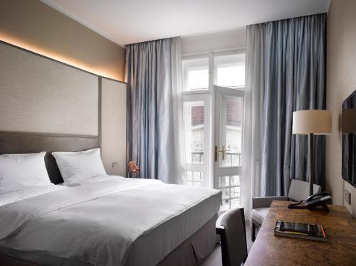 The Emblem Prague Hotel Room Type - Deluxe Double Room with Balcony and with Lounge and Wellness Access The Emblem Prague Hotel Room Type - Deluxe Double Room with Balcony and with Lounge and Wellness Access