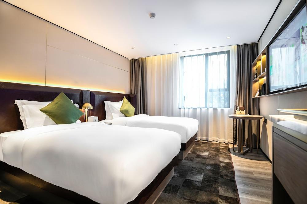Housekeeper Hotel Beijing Road Branch - Tap to explore photos