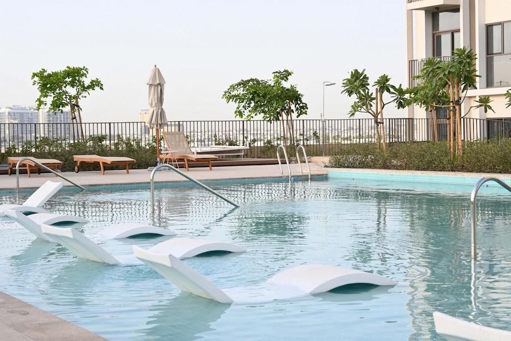 Modern Boho 1BR Sleeps4 Balcony Pool Gym Dxbhills - Tap to explore photos