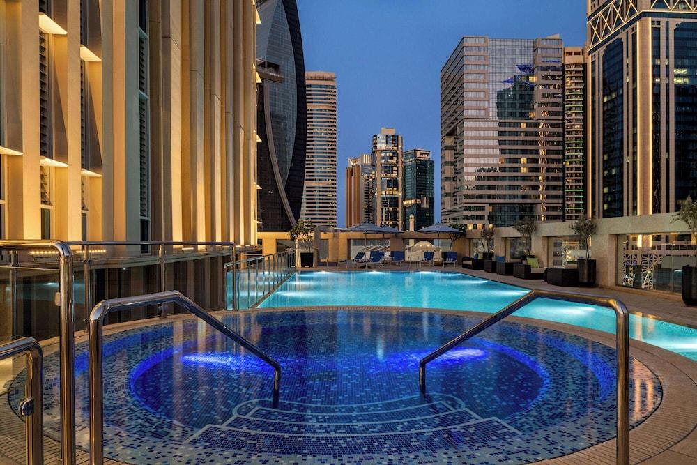 Wyndham Grand Doha West Bay Beach - Tap to explore photos