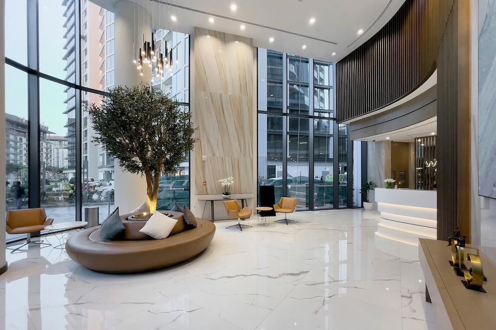 Stylish 1BR in Sobha Grande - Tap to explore photos