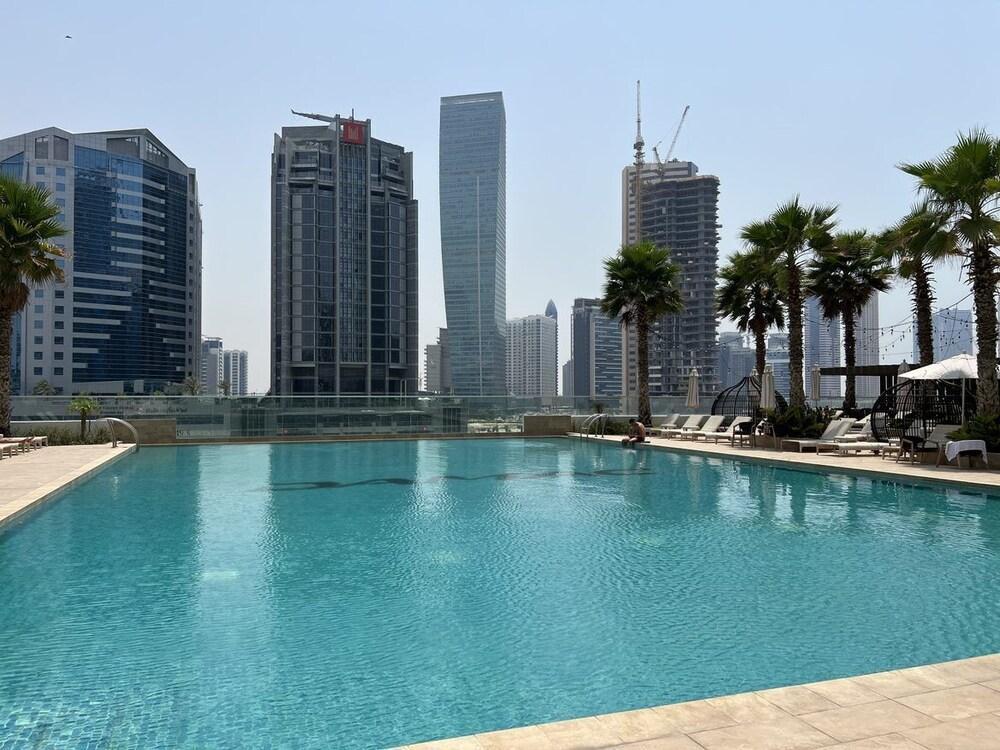 WelHome - Cozy Studio with Canal View in DAMAC Prive - Tap to explore photos
