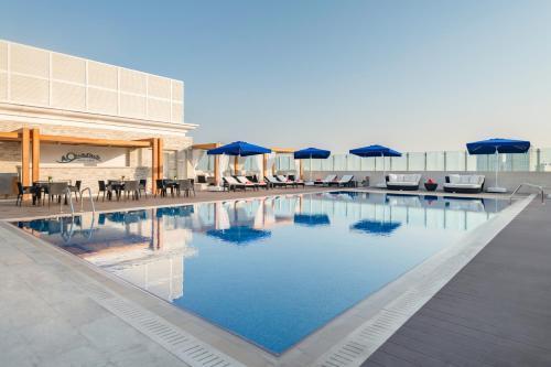 Riviera Rayhaan by Rotana Doha - Tap to explore photos