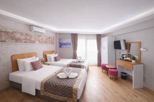 Ria Suites Boutique Hotel Room Type - Standard Triple Room