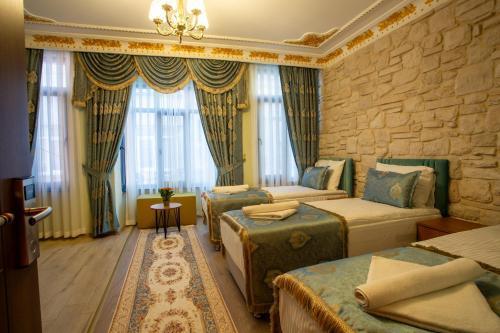 Sayina Hotel Room Type - Deluxe Triple Room Sayina Hotel Room Type - Deluxe Triple Room