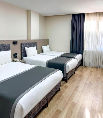 The Business Class Hotel Room Type - Quadruple Room