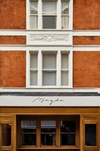 Magda Boutique Rooms - Tap to explore photos