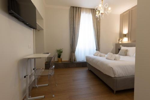De Vince Luxury Suites - Roma Termini - Tap to explore photos