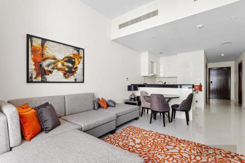 WelHome - Charming Breathtaking 1BR Apt. In Damac Hills - Tap to explore photos