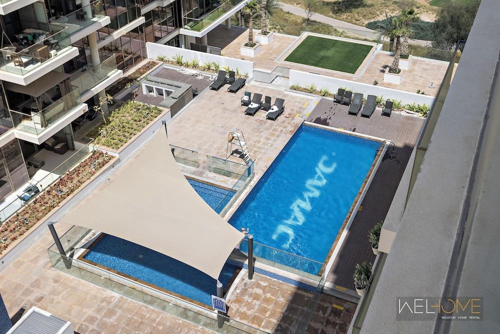 WelHome - Charming Breathtaking 1BR Apt. In Damac Hills - Tap to explore photos