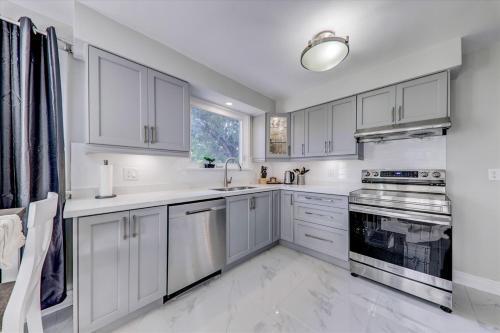 Stunning 7 Br RougeView Home with 2 Kitchens, 5 Bathrooms, Amazing Backyard & 8-Car Parking - Tap to explore photos