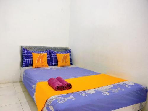 Guest House Natasya Priok by Nusalink - Tap to explore photos