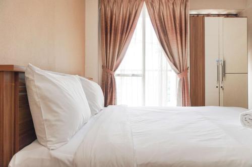 Best Price and Restful Studio at Tifolia Apartment By Travelio