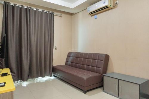 Comfy and Homey 1BR at Sky Terrace Apartment By Travelio - Tap to explore photos