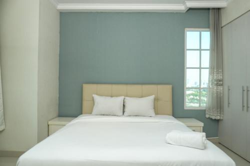 Comfy 1BR at Belleza Apartment By Travelio
