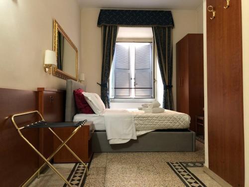 A ROSMINI SUITES - Tap to explore photos