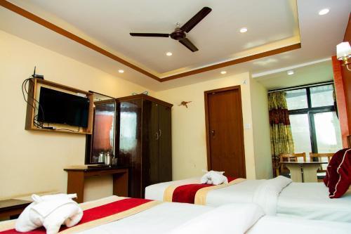Hotel Everest Regency - Tap to explore photos