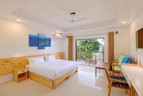 Luau Beach Inn, Maldives - Tap to explore photos