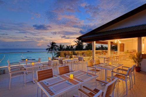 Luau Beach Inn, Maldives - Tap to explore photos