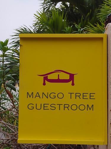 Mango Tree Guestroom - Tap to explore photos