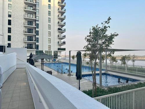 F1 Dreamstay 1BHK Gym Pool - Tap to explore photos