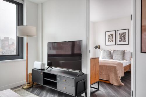 1BR in Hip E Village w Doorman Gym NYC-150 - Tap to explore photos