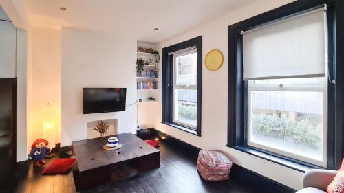 Charming, centrally located Victorian Conversion - Tap to explore photos
