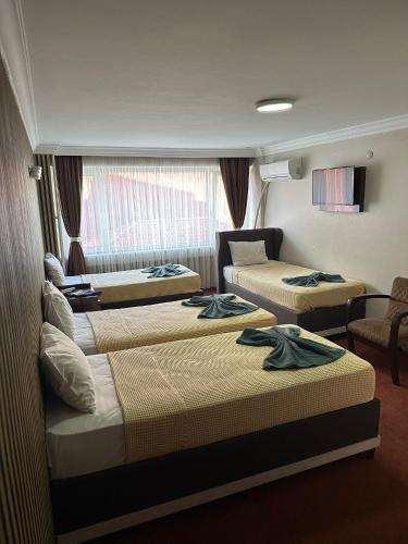 Hotel Metropol 1 Room Type - Quadruple Room with Private Bathroom
