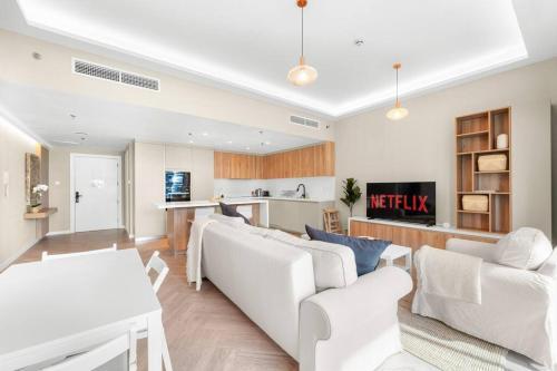 Vibrant 2BR Escape with Pool & Gym - Tap to explore photos