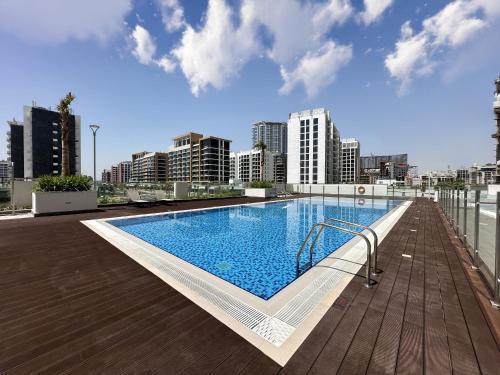 Exquisite 2BR Oasis w Pool View in Meydan - Tap to explore photos