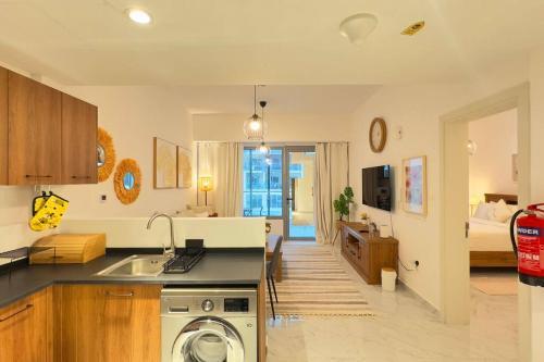 1BR Masdar City - Elegant Stay with Pool & Balcony - Tap to explore photos