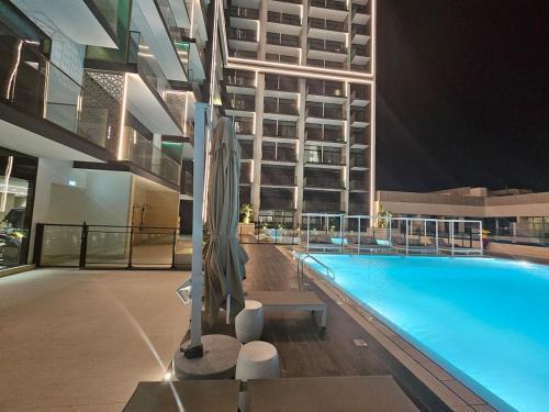 Vacay Lettings - Binghatti Emerald,JVC- Pool View - Tap to explore photos