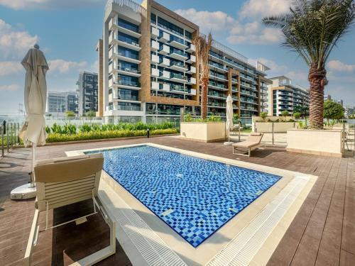 Elegant Studio in Azizi Riviera, Meydan - Tap to explore photos