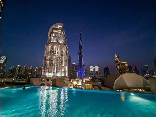 CH Skyline Retreat - Cozy 1BR Apt With Burj Khalifa and Fountain Views - Tap to explore photos