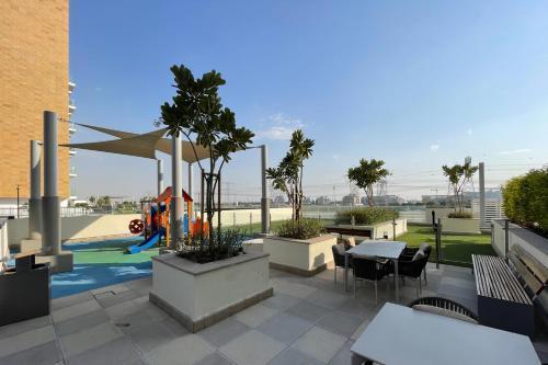 Bright and cozy studio with balcony in Azizi Riviera 33 - Tap to explore photos
