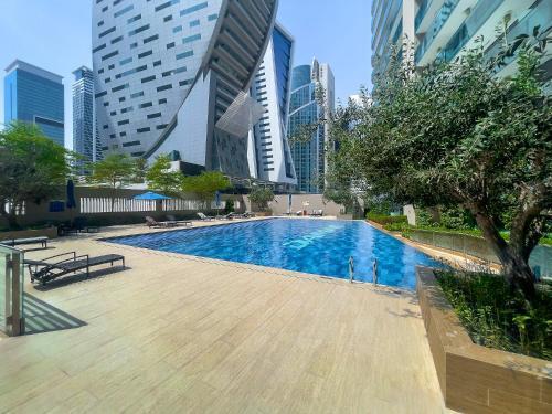 Stylish 1BR Apartment at DAMAC Merano Tower with Great View - Tap to explore photos