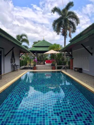 Plumeria Villa Thalang - Tap to explore photos