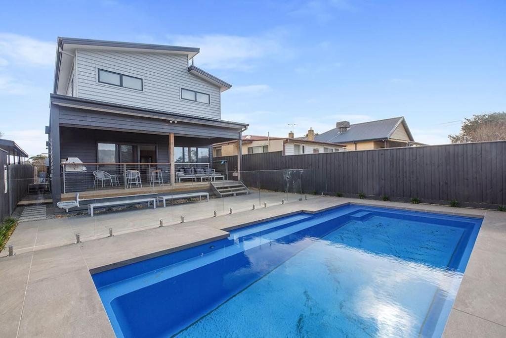 Contemporary Coastal Escape with Sparkling Pool - Tap to explore photos