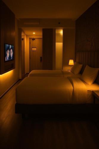 QNZ Hotel Jakarta - Tap to explore photos