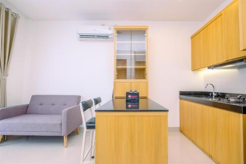 Comfort 1BR at Ciputra World 2 Apartment By Travelio - Tap to explore photos