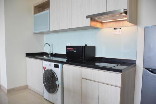 Nice and Spacious 3BR at Menteng Park Apartment By Travelio - Tap to explore photos