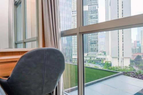 Best Homey and Nice 1BR at Ciputra World 2 Apartment By Travelio - Tap to explore photos