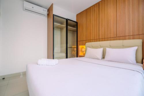 Best Homey and Nice 1BR at Ciputra World 2 Apartment By Travelio - Tap to explore photos