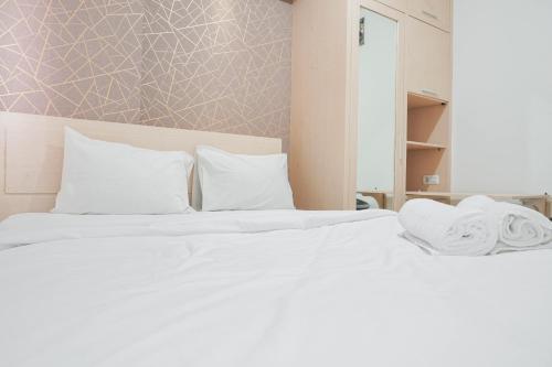 Cozy Stay at 2BR Green Pramuka City Apartment near Shopping Center By Travelio - Tap to explore photos