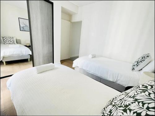 Olympic Park Oasis - New 3b2b condo - Pool, Parking - Tap to explore photos