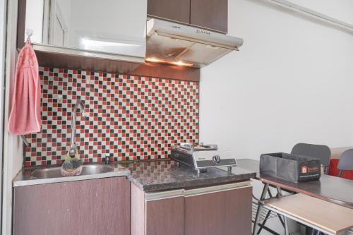 Best Deal and Comfy 2BR at Green Pramuka City Apartment By Travelio - Tap to explore photos