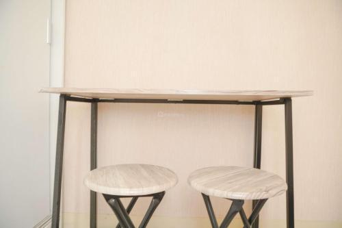 Cozy 2BR Green Pramuka City Apartment near Shopping Mall By Travelio - Tap to explore photos